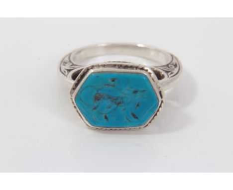 Renaissance style silver ring with turquoise intaglio depicting a lion, in engraved silver setting. Finger size approximately