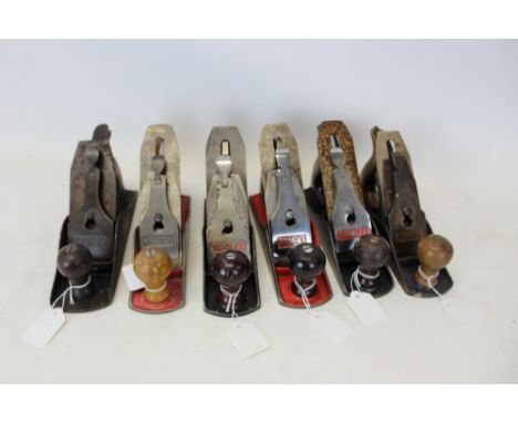 Six vintage smoothing planes - including two Stanley No. 4, one Stanley 4½, others by Salmen's, Acorn and Record