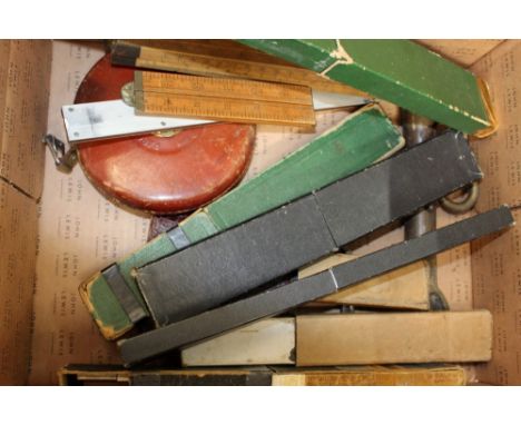 Quantity of vintage slide rules and measures plus old boat hook