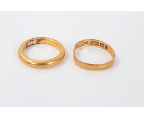 Gold (22ct) wedding ring and a yellow metal wedding ring (2)Condition report: Gold (22ct) ring- band is bent and distorted, r