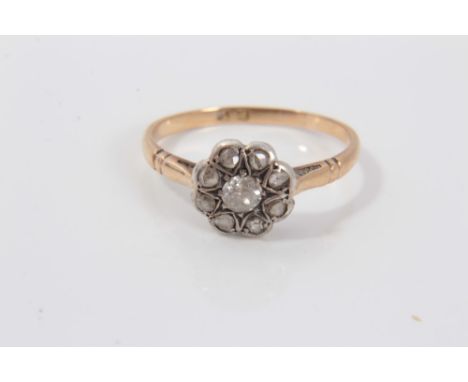 Victorian gold (18ct) diamond flower head cluster ring with a central old cut diamond surrounded by eight rose cut diamonds. 