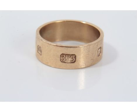 Gold (9ct) thick banded ring with large hallmark decoration, size O.Condition report: Weight approximately 5g