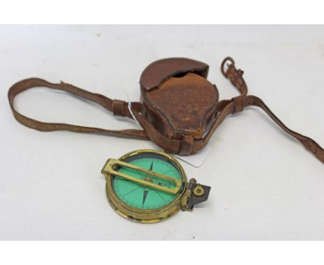 19th century compass with green scale signed Elliott Bros. Strand, London in a brass case engraved on the base D M Smythe in 