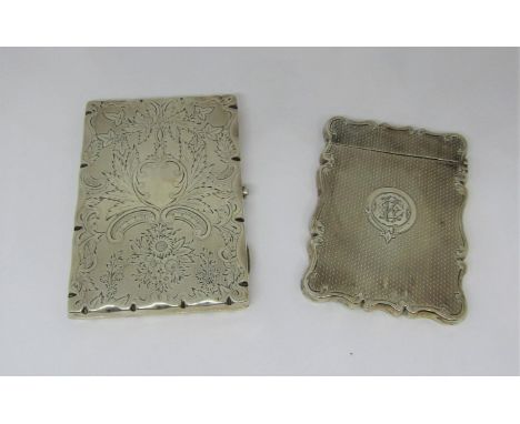 A Victorian silver card case with shaped outline, engine turned detail, Birmingham 1899 and a further example lined in soft l