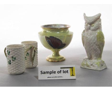 A Belleek vase in the form of an owl, a pair of Belleek mugs with basket weave and Shamrock moulding, a Carltonware lustred v