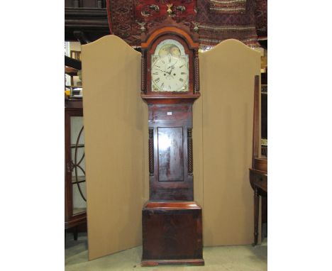 Early 19th century mahogany longcase clock, the trunk with spiral column supports, the arched hood enclosing a broken arch pa