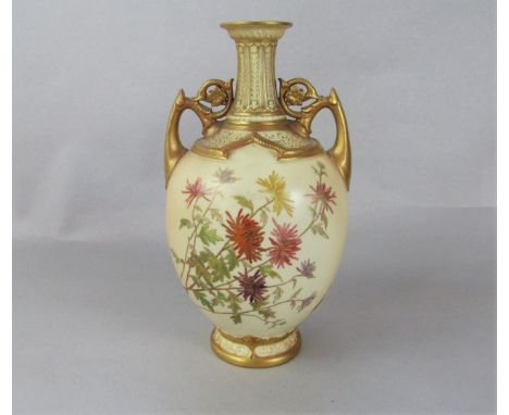 A Royal Worcester blush ivory two handled vase with painted and gilded chrysanthemum decoration and puce printed mark to base