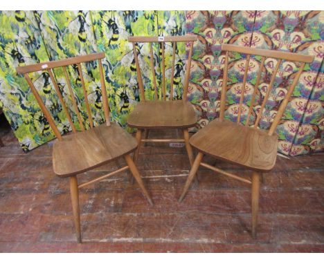 Set of three Ercol light elm comb back dining chairs 