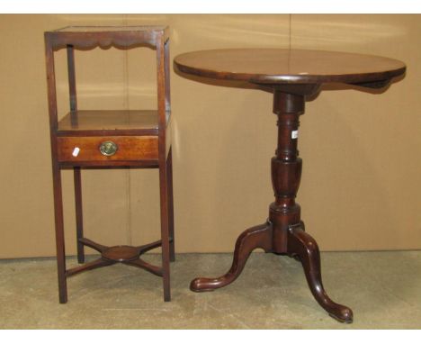 A Georgian mahogany occasional table the circular one piece top raised on a turned vase shaped pillar and swept tripod, 65 cm