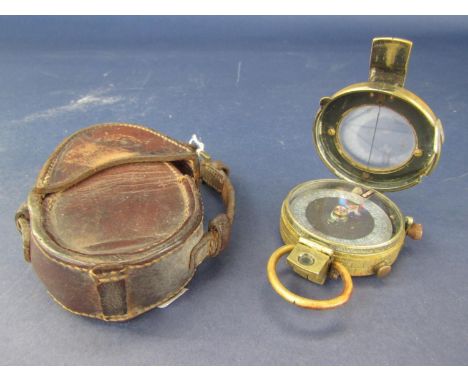 WWI brass pocket compass with leather case 1917, number 90542 and WWII military marching compass, Bakelite case - mark I 
