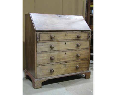 A 19th century mahogany bureau, the fall flap enclosing a fitted interior of small drawers and pigeon holes over four long gr