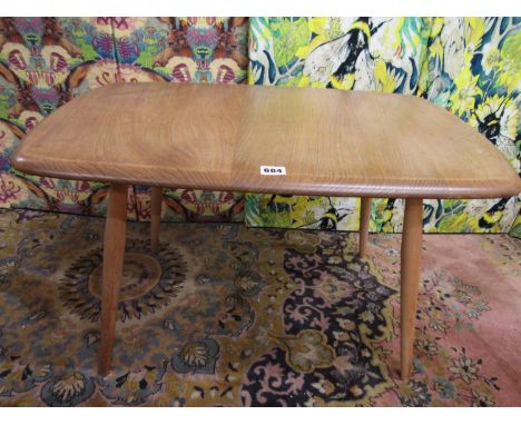 Ercol light elm rectangular coffee table upon spindle legs, 44cm high x 70cm long 