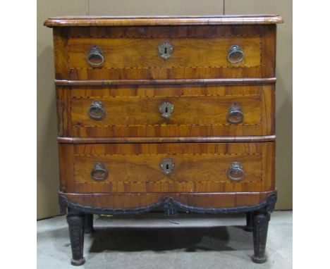 An antique walnut veneered commode of three long drawers with inlaid chequered stringing and radiating square banded detail, 
