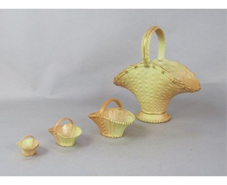 Four graduated Royal Worcester blush ivory baskets, with puce printed marks to base of the largest 993, max measurement 19.5c