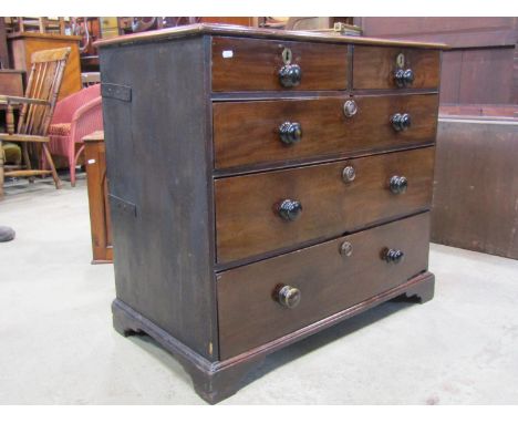 An 18th century mahogany and stained sided chest of three long and two short drawers on shallow bracket supports, 95 cm wide 