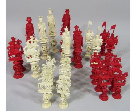 A 19th century Cantonese ivory puzzle ball chess set (all 32 pieces present) kings and queens presented as Chinese royalty, b