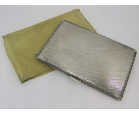 A silver cigarette case with engine turned detail, Birmingham 1959, 6oz approx, together with a soft kid skin case 
