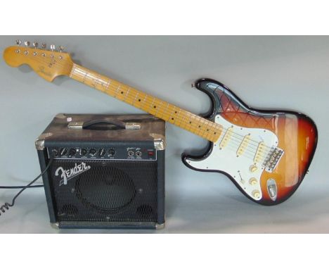 A Fender electric left handed guitar serial number F011173, together with a Fender Amplifier, 38 watts, type PR241 serial num