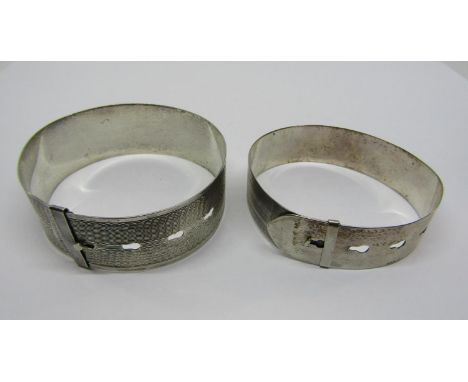 Charles Horner silver adjustable belt bangle with engine turned detail, together with a similar larger example stamped 'sterl