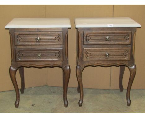 A pair of bedside or lamp tables, each with two frieze drawers, raised on short cabriole supports, beneath painted tops, 45cm