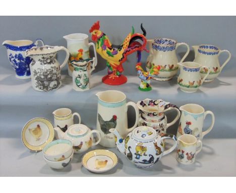 A collection of ceramics relating to poultry including three graduated Brixton pottery jugs, further decorative jugs includin