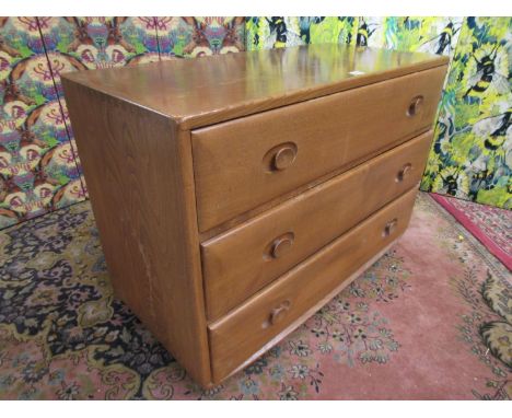 Ercol light elm three drawer chest, 68cm high x 91cm wide 