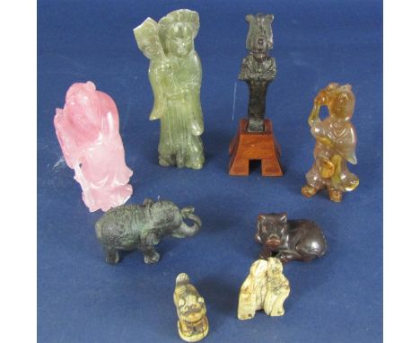 Three bone work Chinese Netsuke, archaic iron Eygptian figure on later timber stand, three further Chinese carved figures, et