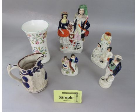 A collection of 19th century Staffordshire wares including a figure group with goat and dog, an arbour group, four spill vase