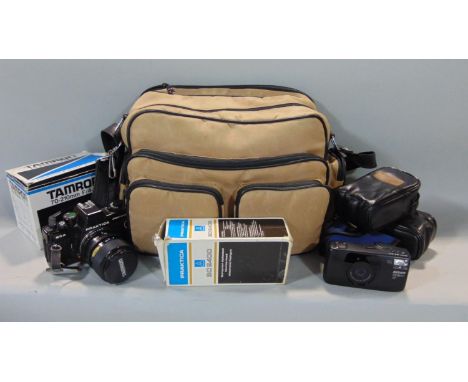 A Praktica BCA Electronic camera, a Nikon Zoom 310AF camera, a Nikon Lite.touch Zoom 110S camera, etc, all in a carrying case