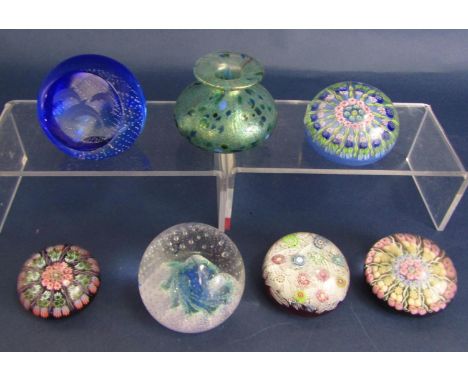 A collection of Scottish glass paperweights including three Perthshire Millefiori examples, one with bird canes, a Caithness 