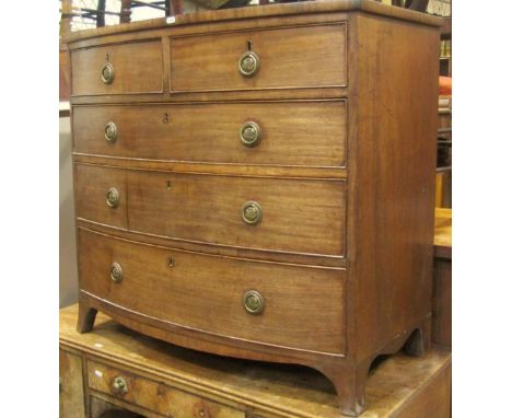 A Regency mahogany bow fronted bedroom chest of two short over three long graduated drawers raised on swept bracket supports,