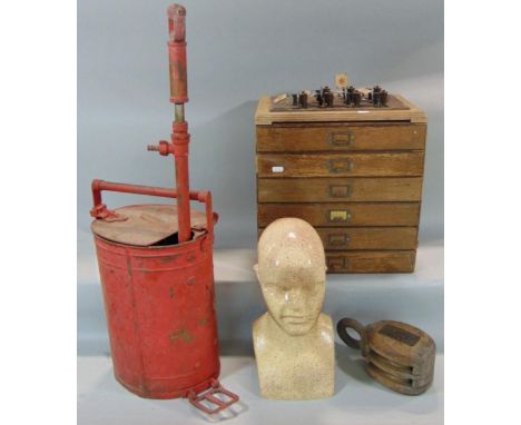 A vintage oak stationery box with six drawers, a pulley block, a vintage stirrup pump and an art deco style mannequin head 