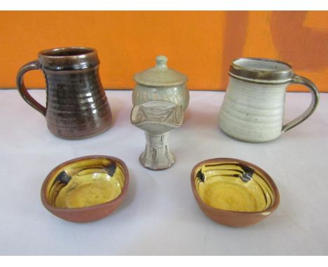 David Leach - Collection of studio pottery comprising two tankards, a lidded preserve pot, a candlestick and two slip ware tr