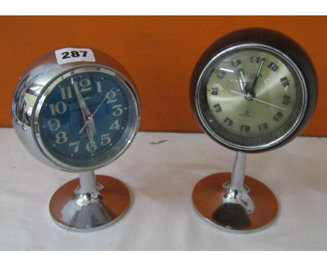 Rhythm space age alarm clock upon a tulip base, together with a similar Presta example (2) 