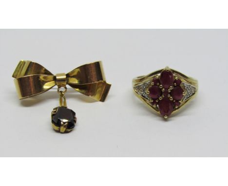 Antique 15ct articulated bow brooch set with a garnet, 3.6g, together with a modern 9ct ruby and diamond ring of quatrefoil d