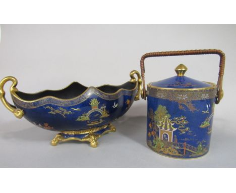 A Carlton ware blue ground two handled bowl of oval form with gilded and enamelled chinoiserie type decoration, painted numbe