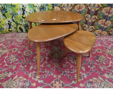 Ercol - Nest of three light elm 'Pebble' tables, the largest 64cm wide x 40cm high (3) 