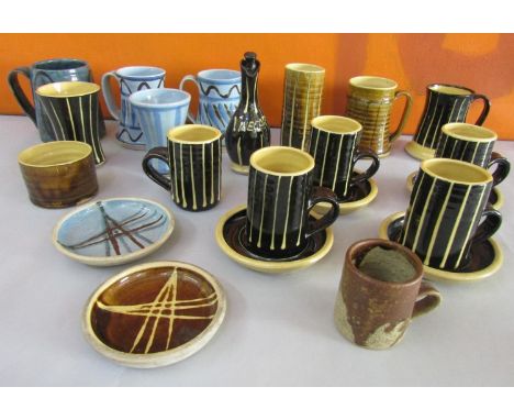 A collection of studio pottery by John Buccanan or Arch Pottery Cornwall comprising various mugs and cups, saucers, condiment