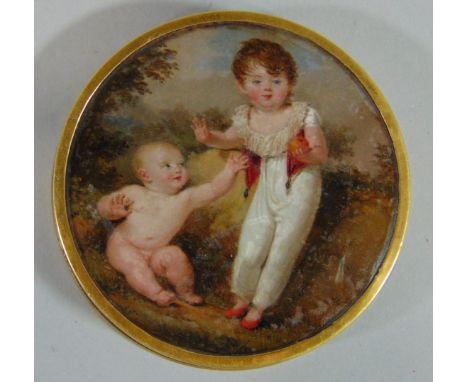 A good quality 19th century school portrait of circular form on tortoiseshell showing a young child in white and red costume 