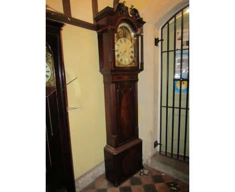 A Regency period mahogany longcase clock, the door with lancet shaped outline flanked by reeded sides with conche shell inlay