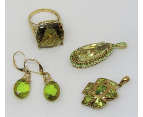 Collection of 9ct dress jewellery set with green gemstones, comprising a ring, a pear cut pendant and a pair of drop earrings