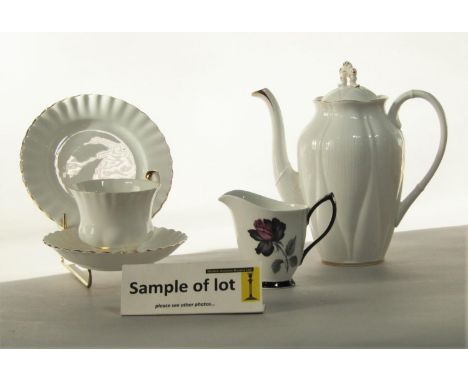 A collection of Royal Albert coffee wares in the Masquerade pattern comprising coffee pot, pair of cream jugs, sugar bowl, ei