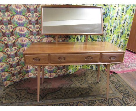 Unusual good quality Ercol light elm dressing chest, the raised mirror back over a base fitted with three drawers upon square