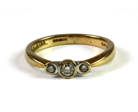 A 9ct yellow gold three diamond set ring, (N.5).