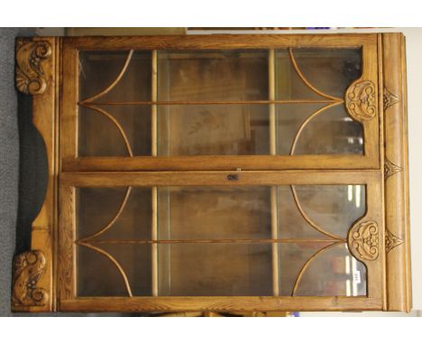 A 1930's light oak bookcase, W. 90cm, H. 130cm.