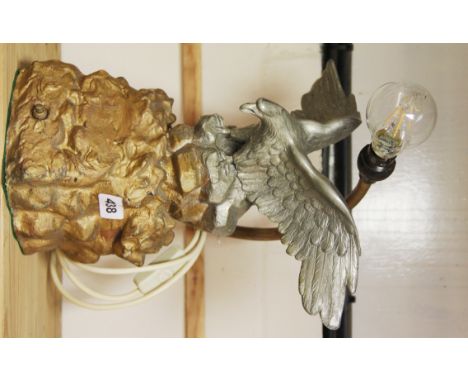 A spelter eagle figure mounted as a table lamp, H. 36cm.