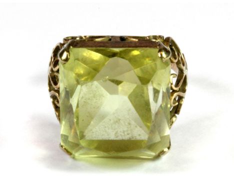A yellow metal (tested minimum 9ct gold) citrine set ring, (K).