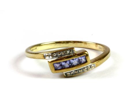 A 9ct yellow gold diamond and tanzanite set ring, (P.5).