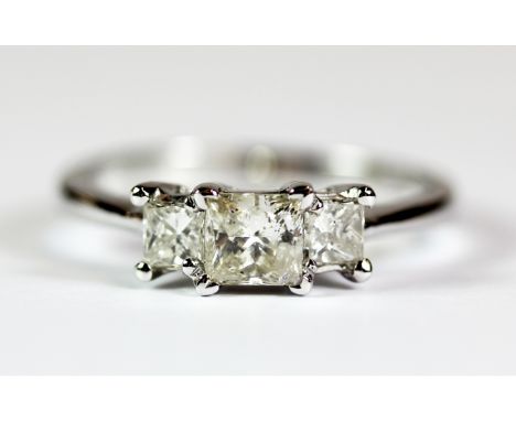 An 18ct white gold ring set with three princess cut diamonds (centre stone approx 0.5ct). Ring size O