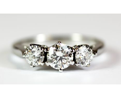 A pretty 18ct white gold ring set with three brilliant cut diamonds, total weight approx 1.25ct. Ring size M.5